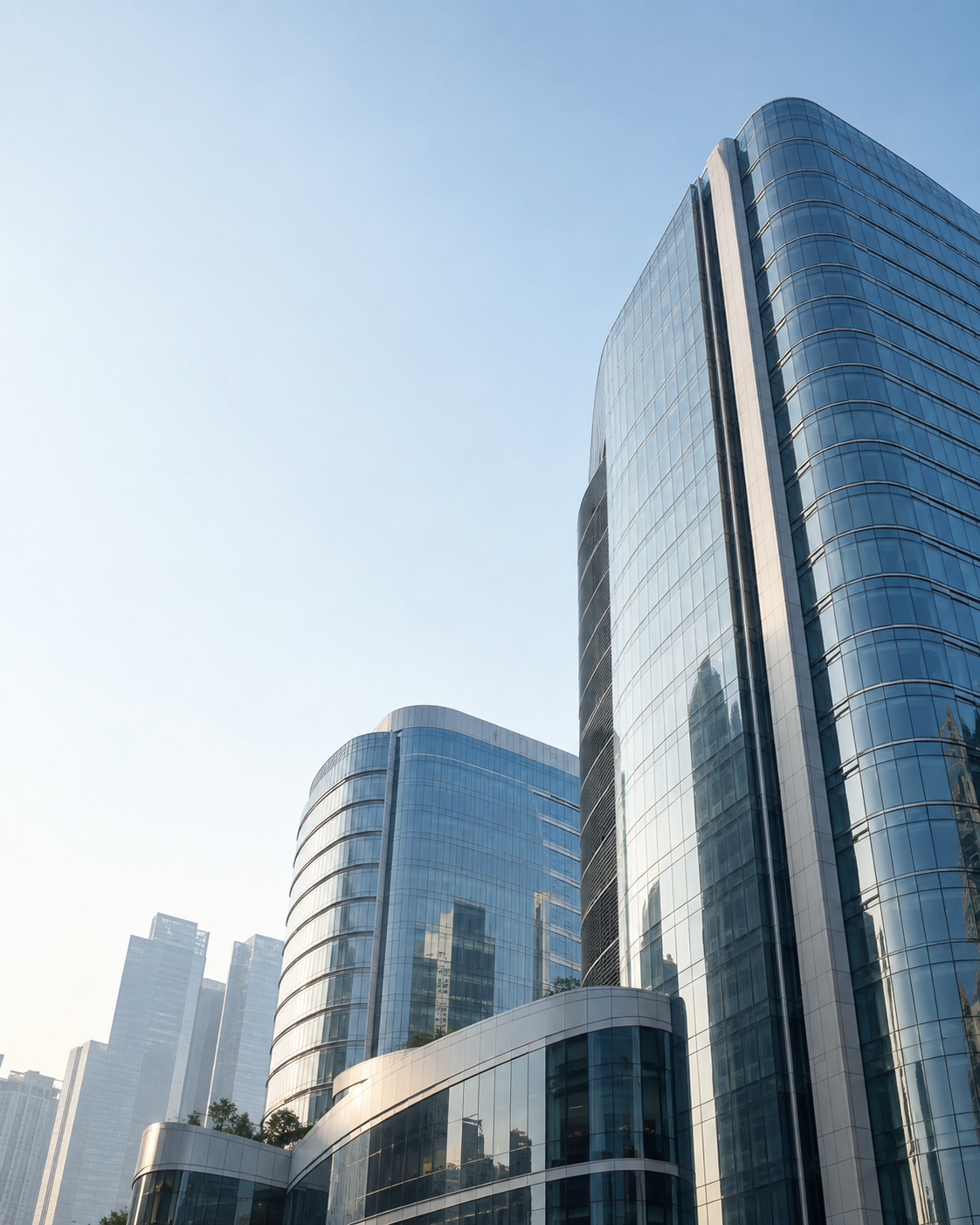 Upward view of contemporary glass office towers